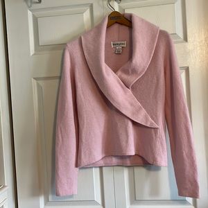 Pretty pink open neck sweater.